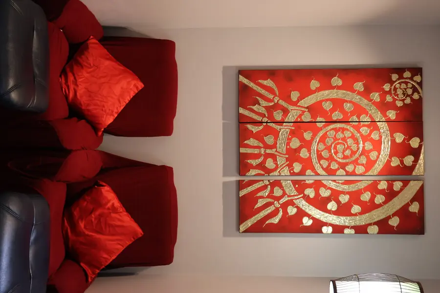 Massage Eden Auckland CBD relaxation lounge with Thai wall art