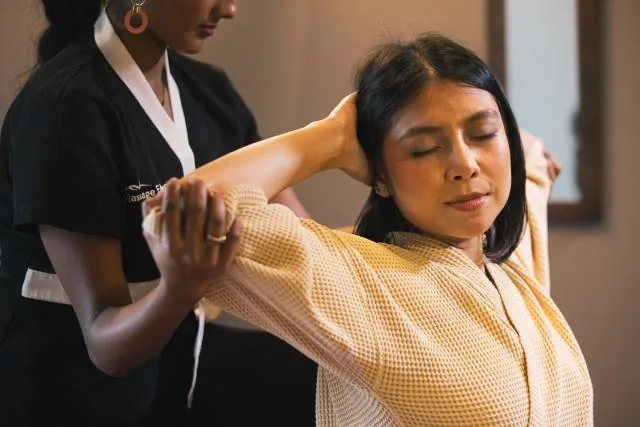 Thai massage assisted shoulder stretch at Massage Eden Auckland CBD